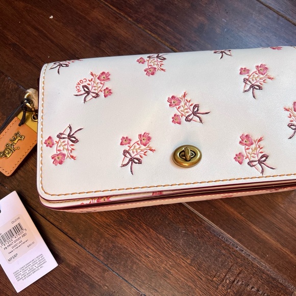 Coach Handbags - NWT Coach 1941 Dinky Bag,with Floral Bow Print.
Limited Edition Collection